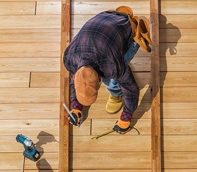 Image of a contractor installing a deck