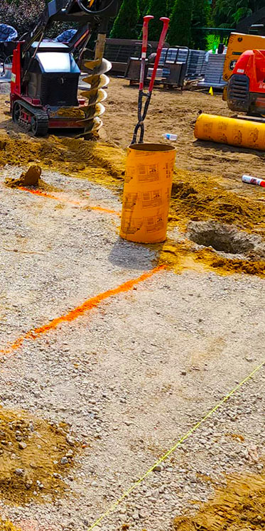 image of deck footings being prepared for installation