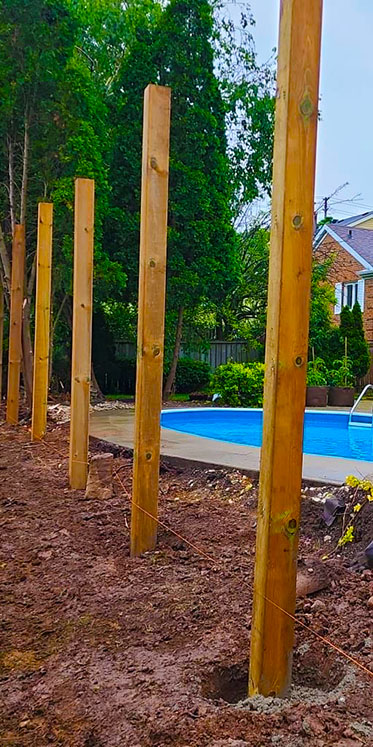 Image of a Post2Fence post installation in a backyard