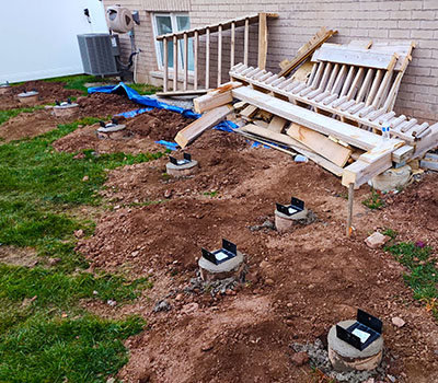 Image showcasing Post2Fence deck footing work