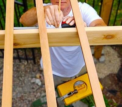 Image of a contractor working on a pergola