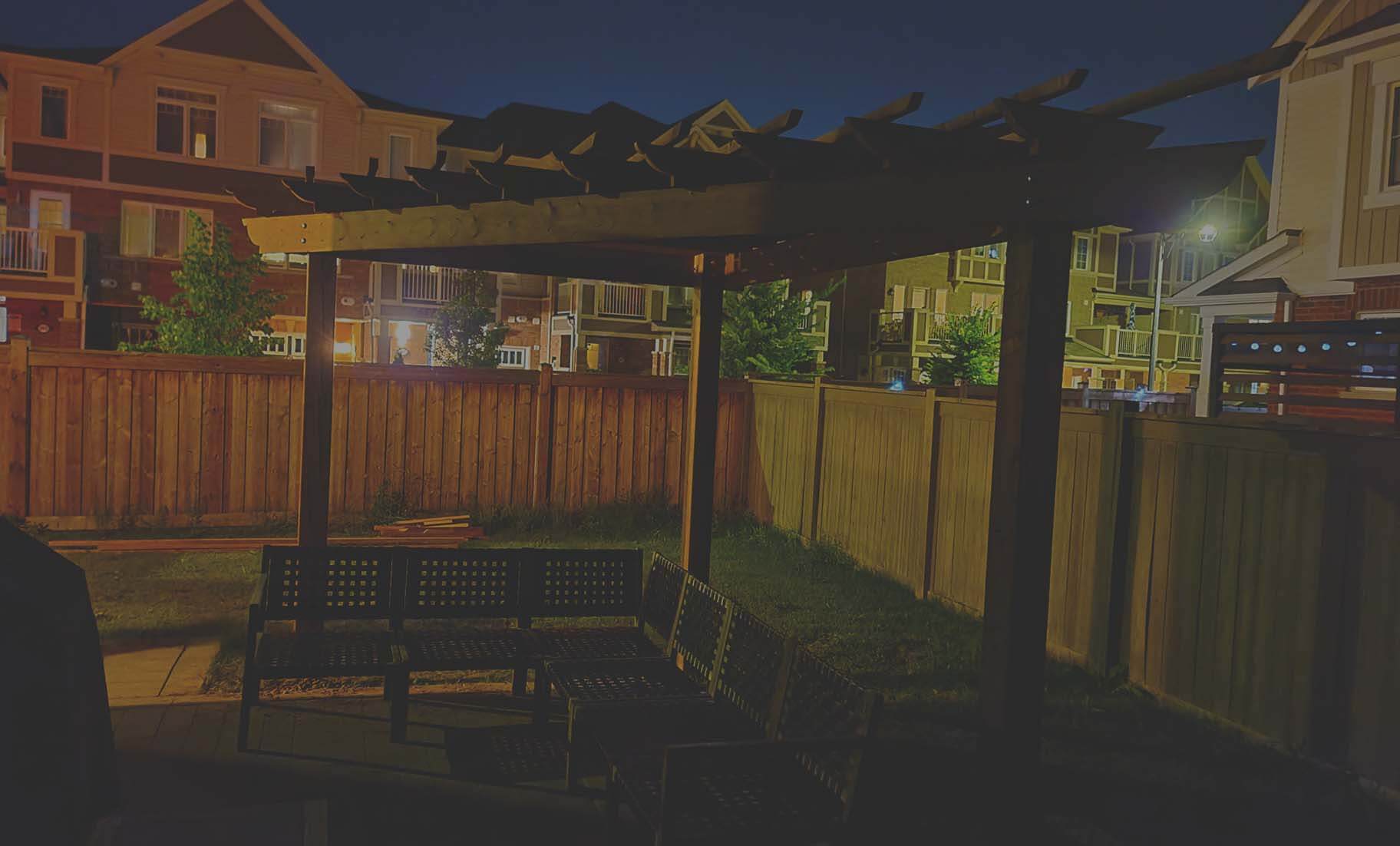 Image of a triangular gazebo in a backyard