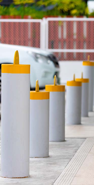 Image of bollards installed near a parking lot