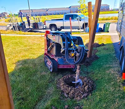 Image of a Post2Fence post digging machine drilling holes